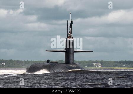 The U.S. Navy Ohio-class nuclear-powered ballistic missile USS Florida transits the Saint Marys River as it departs Naval Submarine Base Kings Bay July 3, 2013 in Kings Bay, Georgia. Stock Photo