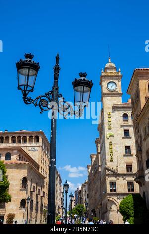 SALAMANCA, SPAIN - MAY, 2018: View of the beautiful street lamps and antique buildings at Zamora Street in Salamanca city center