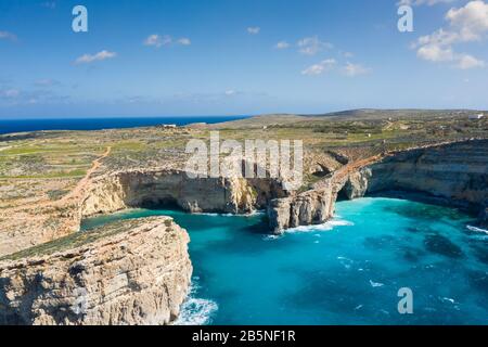 Aerial drone photo - The famous Blue Lagoon in the Mediterranean Sea. Comino Island, Malta. Stock Photo