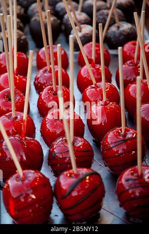 Sweet glazed red toffee candy apples on sticks stock photo stock photo Stock Photo