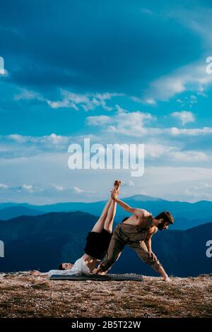 The two young modern ballet dancers training dance routine at the mountain hill Stock Photo