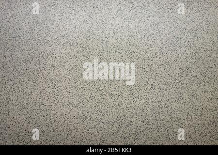Gray textured background. Small plain dots grunge backdrop wall. Design pattern template with copy space Stock Photo