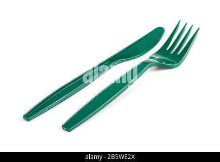 Green plastic knife and fork isolated on white background Stock Photo