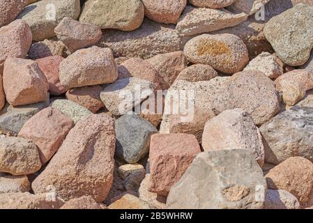 Pile of big rocks boulders. Background of brown stones Stock Photo