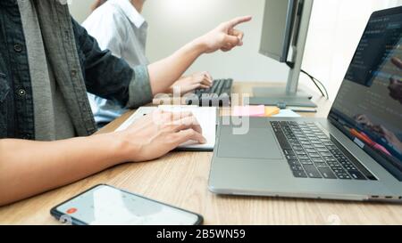 Collaborative work Software engineers website developer technologies or programmer working coding on startup ai application project on screen with par Stock Photo