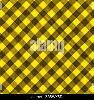The texture of the bright yellow of binding gingham fabric. Yellow textile background. Fabric plaid. Close-up Stock Photo