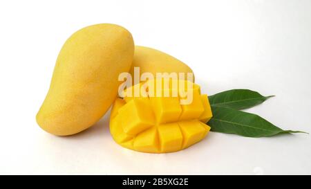 Close up view of mangoes fruit and mango cut in cubes, tropical fruit isolated on white background Stock Photo