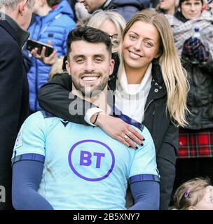 EDINBURGH, SCOTLAND - MARCH 08: Adam Hastings and his partner during the 2020 Guinness Six Nations match between Scotland and France at Murrayfield on March 8, 2020 in Edinburgh, Scotland. (Photo by MB Media) Stock Photo
