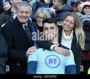 EDINBURGH, SCOTLAND - MARCH 08: Adam Hastings celebrates with his partner, mother and his dad, the legendary Gavin Hastings, during the 2020 Guinness Six Nations match between Scotland and France at Murrayfield on March 8, 2020 in Edinburgh, Scotland. (Photo by MB Media) Stock Photo