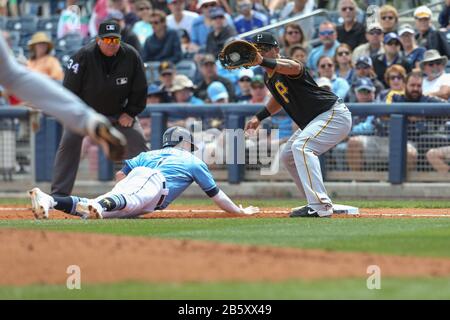 Tampa Bay Rays shortstop Willy Adames (1) dives bak into first as Pittsburgh Pirates third baseman Jose Osuna (36) tries to get the out during a spring training baseball game, Sunday, March 8, 2020, in Port Charlotte, Florida, USA. (Photo by IOS/ESPA-Images) Stock Photo