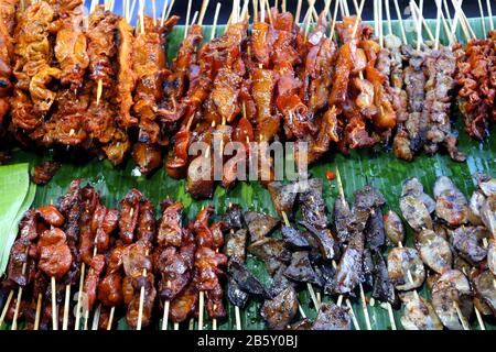 Photo of assorted chicken and pork innards in barbecue sticks sold at a street food stall Stock Photo