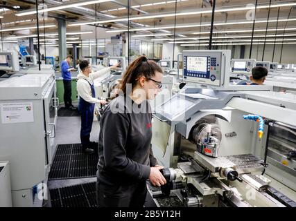 Remscheid, North Rhine-Westphalia, Germany - Trainee woman in metal professions working at the lathe, vocational training centre of the Remscheid meta Stock Photo