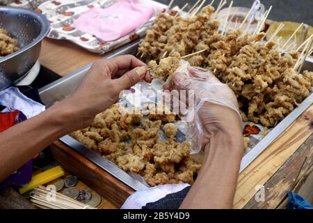 Photo of Filipino local delicacy called butche and bato bato or deep fried chicken esophagus Stock Photo