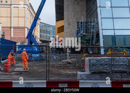 Construction workers at work on the refurbishment of Queen Street Train Station in March 2020 in Glasgow City Centre. Stock Photo