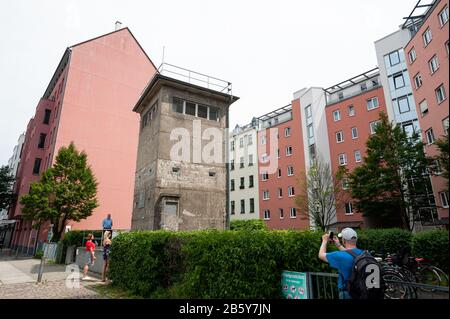 10.06.2019, Berlin, Germany, Europe - The former East German watchtower at Kieler Eck command post in Berlin-Mitte, surrounded by apartment blocks. Stock Photo