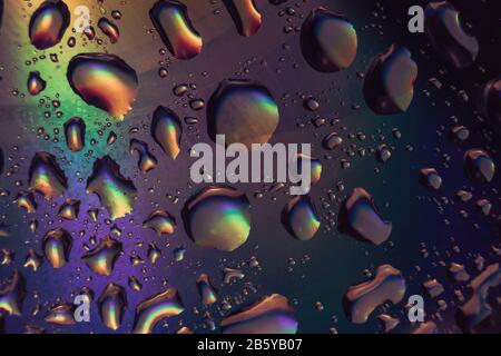 Beautiful abstraction magic color light water drop of holographic effect. Background pattern for design. Macro photography view. Stock Photo