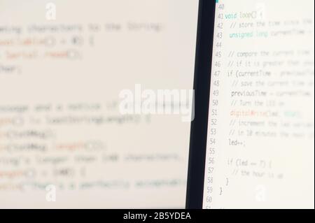 Computer programming theme. Text lines of program script Stock Photo