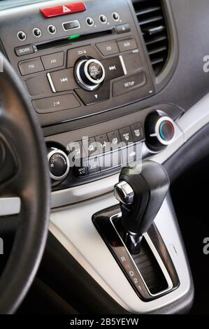 Automatic gear stick of modern car with button on dashboard Stock Photo