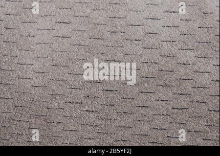 Gray fabric perforated background close up view Stock Photo