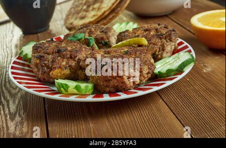 Shami kebab, variety of kebab, originating from the Indian subcontinent,  Awadhi cuisine, Traditional assorted Indian  dishes, Top view. Stock Photo