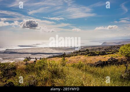 View from Chain Of Craters Road over the hardening lava and out to the Pacific Ocean in Hawaii Stock Photo