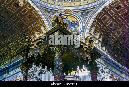 Italy. Rome.St.Peter's Cathedral.The top section (canopy) of Bernini's Baroque high altar stands in the centre of the church. Stock Photo
