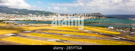 View across Honolulu airport to Honolulu beach and Diamond Head on O'ahu, Hawaii Stock Photo