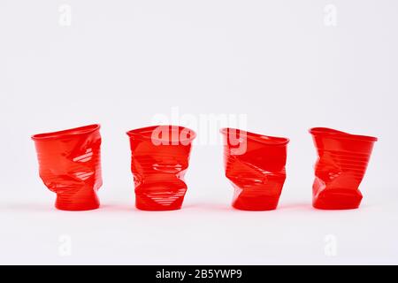 Four disposable plastic cups on white background Stock Photo