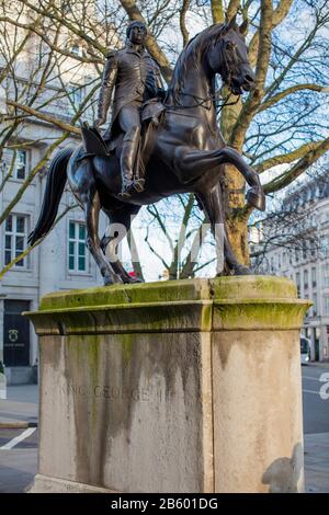 Bronze statue of King George III riding a horse, in Cockspur St, London SW1; sculpted by M Cotes Wyatt on a Portland stone plinth. Stock Photo