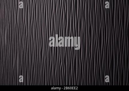 Wooden black undulating surface texture. Close up Stock Photo