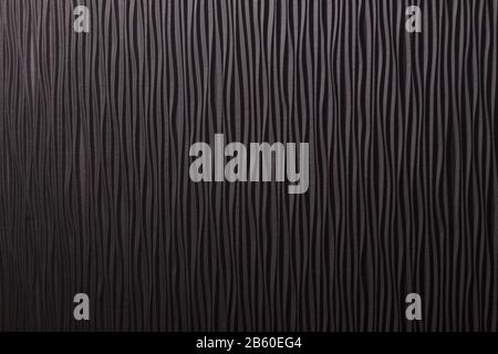 Wooden black undulating surface texture. Close up Stock Photo