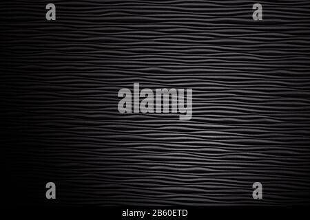 Wooden black undulating surface texture. Close up Stock Photo
