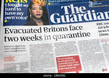 'Evacuated Britons face two weeks in quarantine' in Britain on leaving China coronavirus Guardian newspaper front page headline London 30 January 2020 Stock Photo