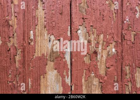 Red rustic reclaimed wooden wall background. Close up. Stock Photo