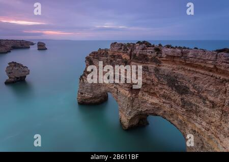 Landscape of the South Coast of Portugal at Sunrise. Marinha Beach is a holiday destination for its beautiful beaches with cliffs and hot water. The a