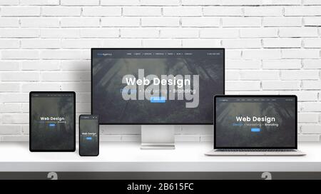 Web design agency concept presentation on displays of different dimensions. Modern flat web design template, theme concept. White brick wall in backgr Stock Photo