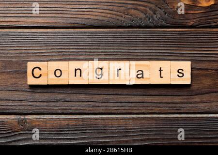 Congrats word written on wood block. Congrats text on wooden table for your desing, Top view concept. Stock Photo