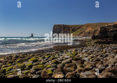 Sea scape stone needle. Portugal Aljezur Algarve, long exposure.
