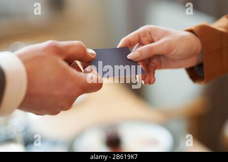 Closeup portrait of two successful business executive exchanging business card Stock Photo