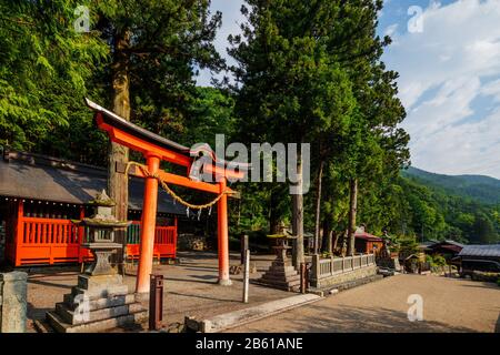 Japan, Honshu, Nagano prefecture, Nakasendo old post town of Tsumago, Tsumago shrine torii gate Stock Photo