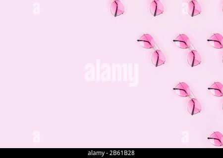 Pink stylish glasses on a pink background Stock Photo