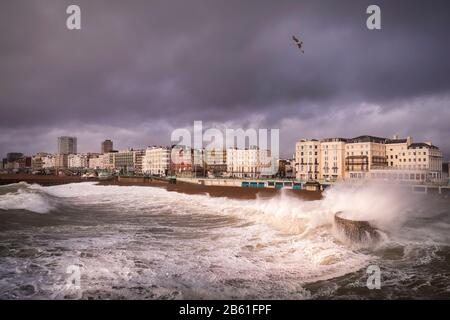 waves and a storm blowing into Brighton Stock Photo