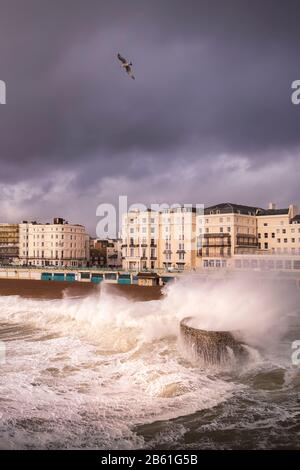 waves and a storm blowing into Brighton Stock Photo