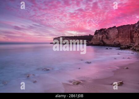 Fiery red sky at Seascape in Portugal. Algarve. Stock Photo
