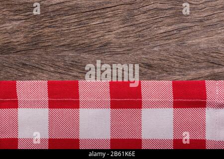Frame of kitchen towels. On wooden texture. Stock Photo