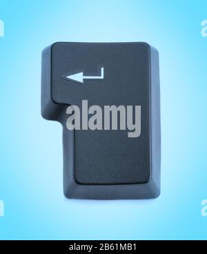 Computer key enter from the keyboard. On a blue background. Stock Photo