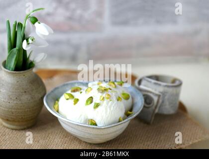 white ice cream with pistachio  food background shot with copy space and room for text Stock Photo