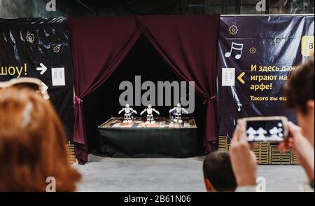 UFA, RUSSIA - AUGUST 21 2017: Robots are dancing at the exhibition in the ULTRA mall Stock Photo