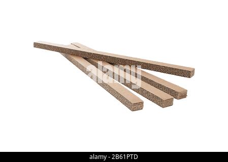 Corrugated cardboard narrow panels isolated on white. Fiberboard carton inner packing pieces. Stock Photo