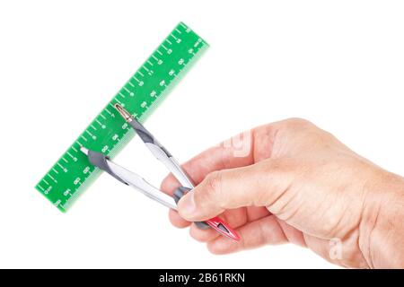 The compass and ruler in hand of the architect. For an accurate measurement. Stock Photo